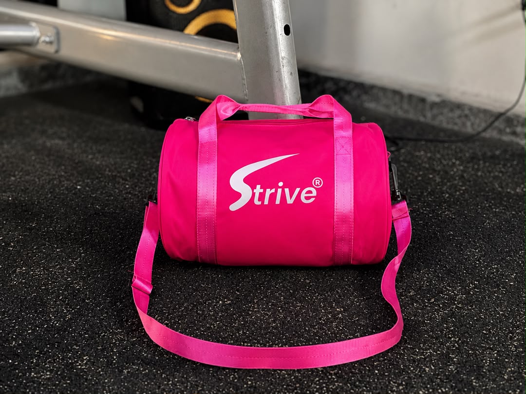 WhatsApp Image 2026-08-21 at 18.35.15 Strive Elite Mini Duffle Bag – Neon Pink - Image 1